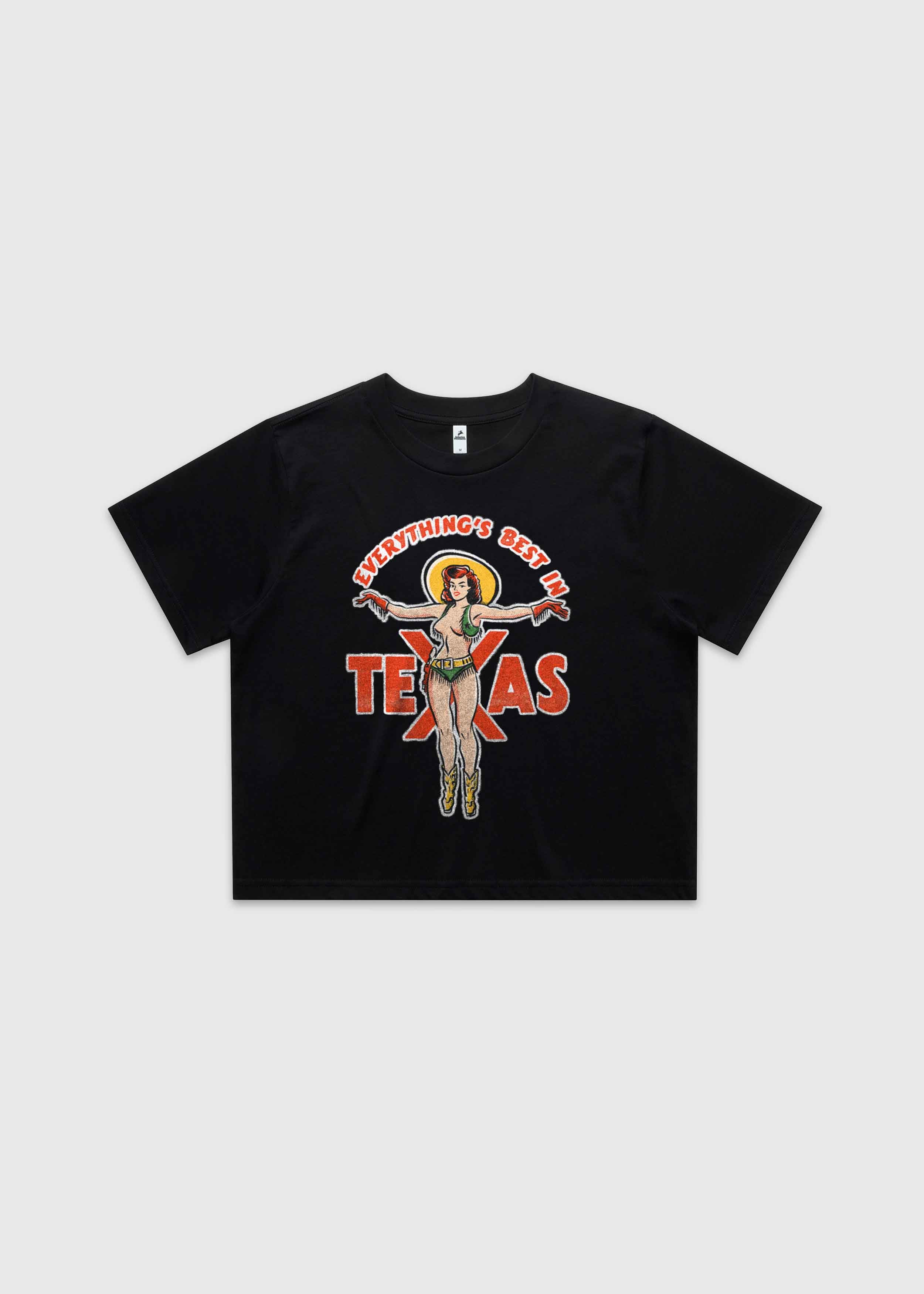 Black cropped t-shirt featuring a retro cowgirl illustration with the text “Everything’s Best in Texas,” premium Western graphic tee by America Provisions.
