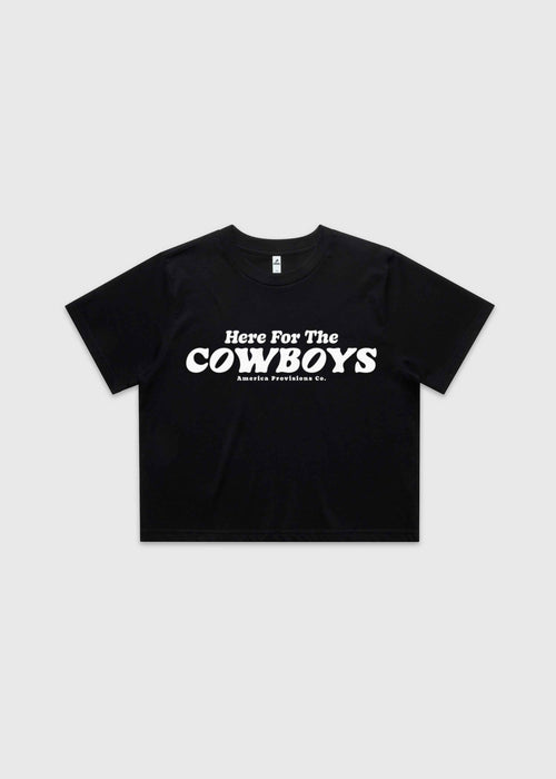 Black cropped t-shirt with bold red “Here For The Cowboys” Western graphic, structured boxy fit, heavy cotton fabric, America Provisions apparel product photo on a neutral background.