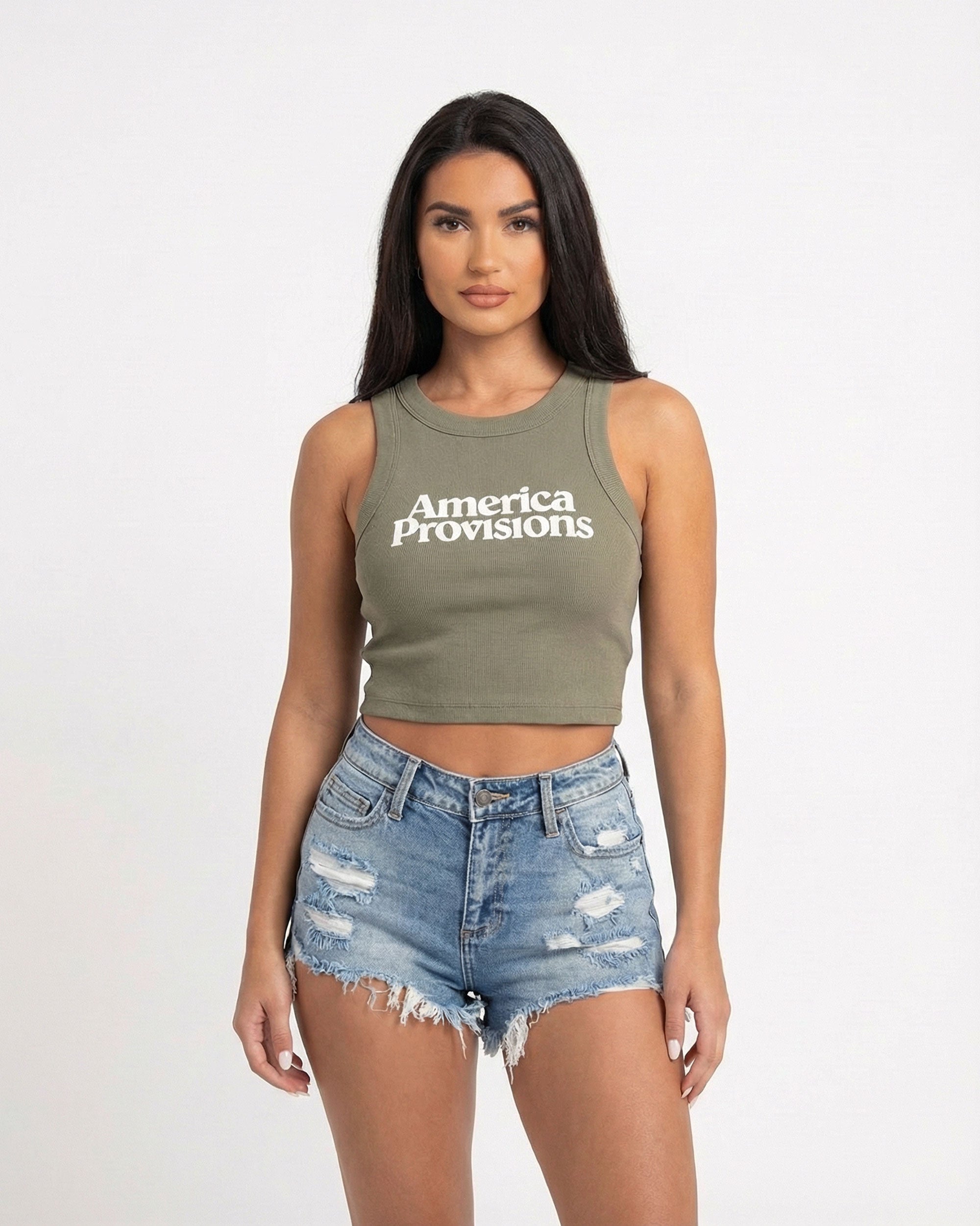 Eucalyptus crop top with America Provisions logo on. Blonde model is wearing the crop top and denim shorts