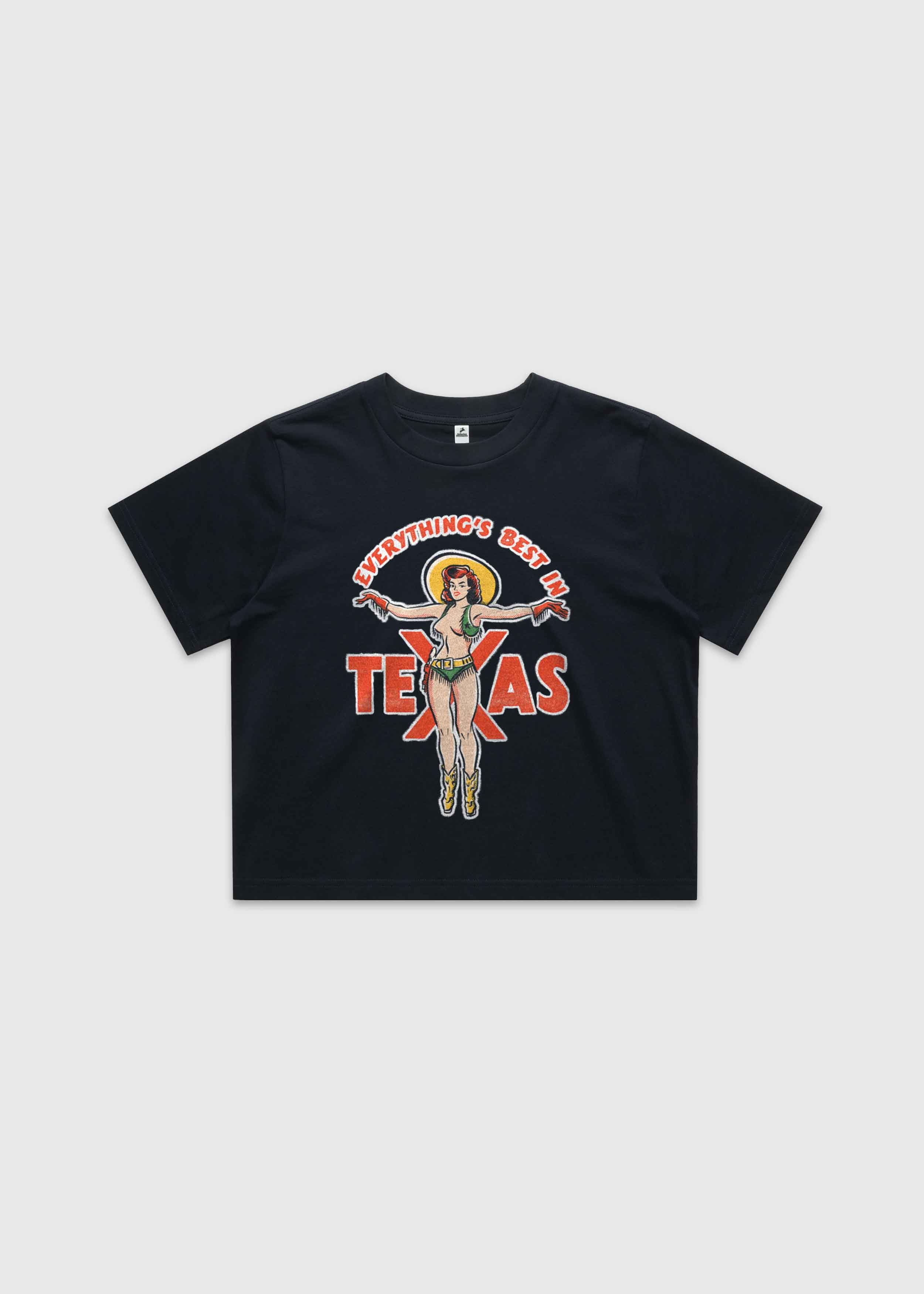 Navy cropped t-shirt featuring a retro cowgirl illustration with the text “Everything’s Best in Texas,” premium Western graphic tee by America Provisions.