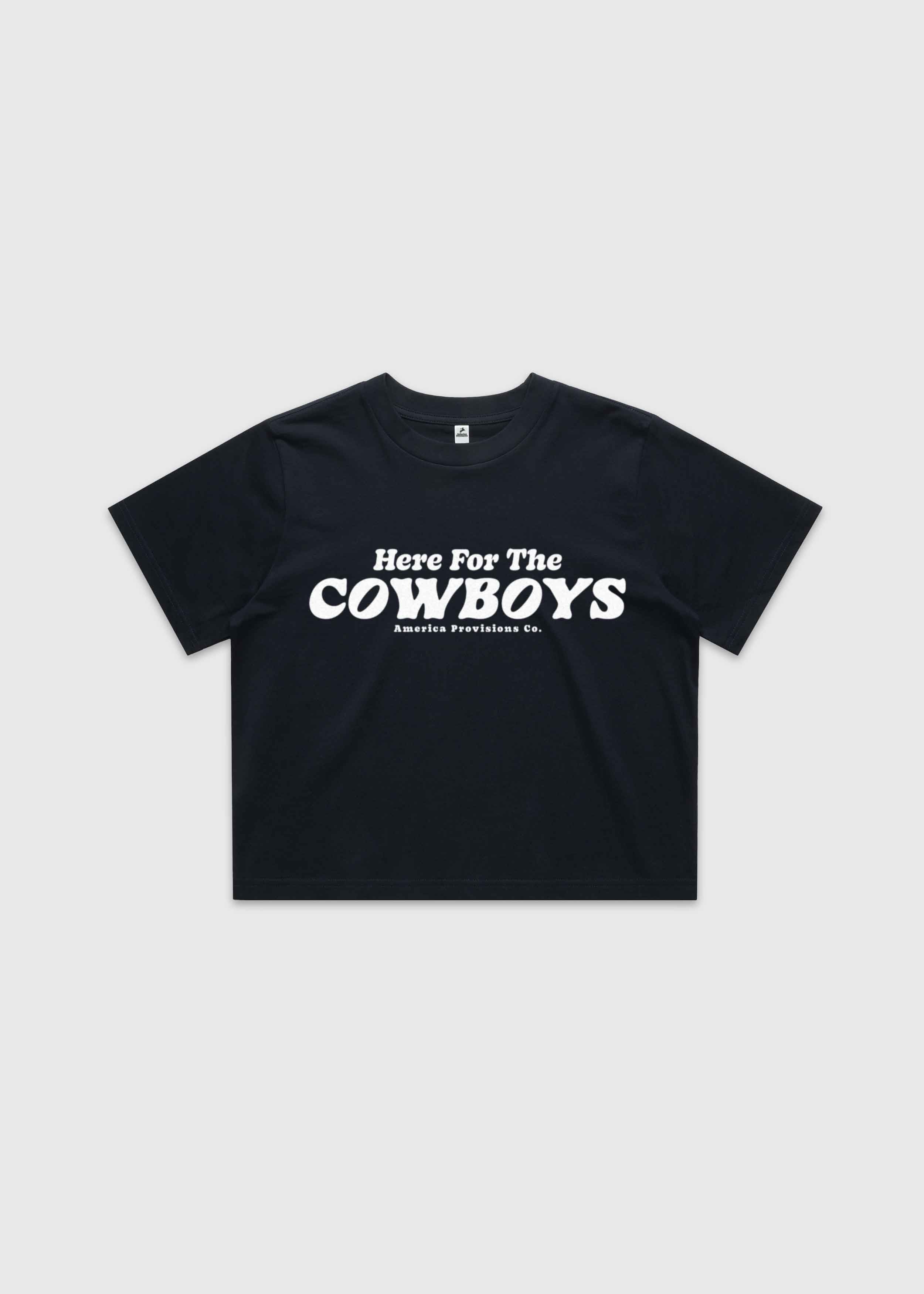Navy cropped t-shirt with bold red “Here For The Cowboys” Western graphic, structured boxy fit, heavy cotton fabric, America Provisions apparel product photo on a neutral background.
