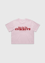 Pink cropped t-shirt with bold red “Here For The Cowboys” Western graphic, structured boxy fit, heavy cotton fabric, America Provisions apparel product photo on a neutral background.