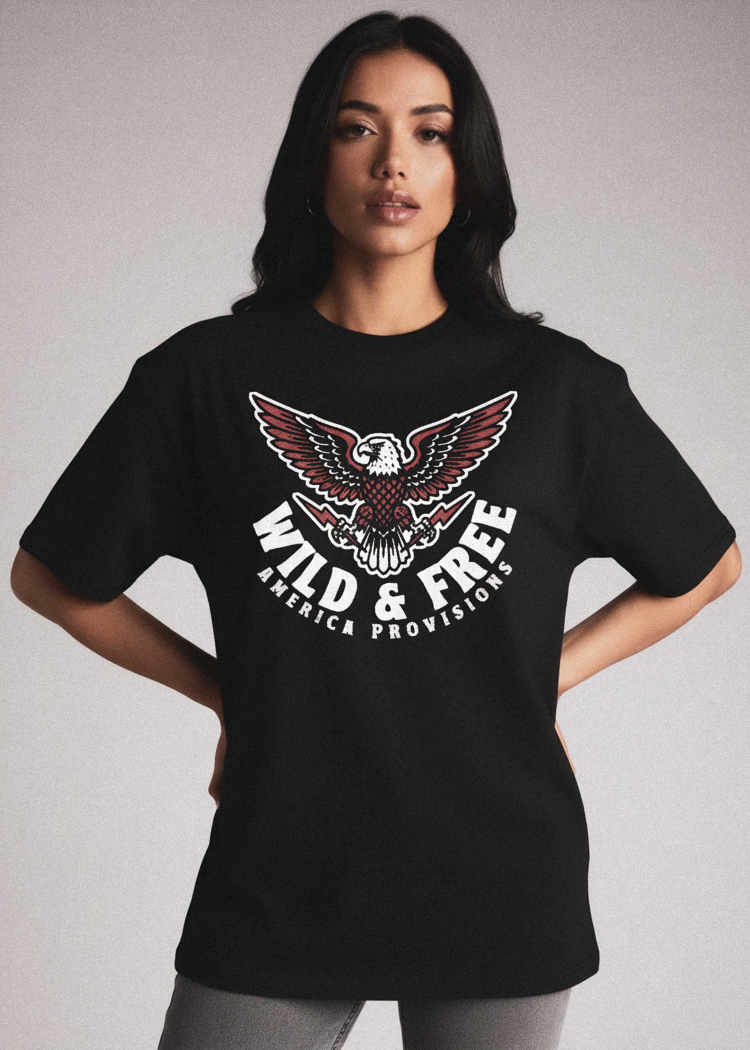 Female model wearing a black t-shirt with an eagle graphic and 'Wild & Free' text on a plain background
