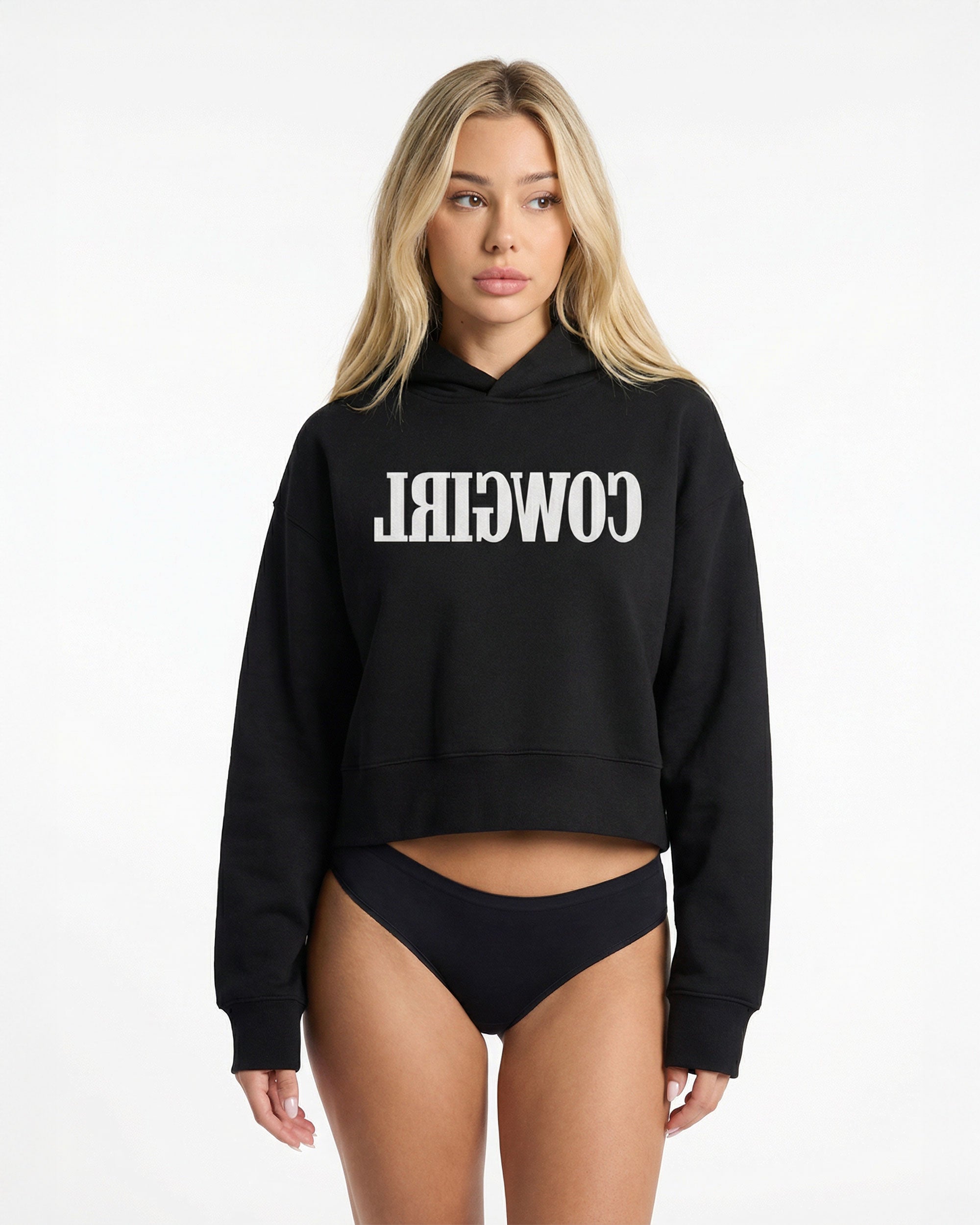 Reverse Cowgirl Woman wearing a cropped black hoodie with 'COWIRL' text on a white background