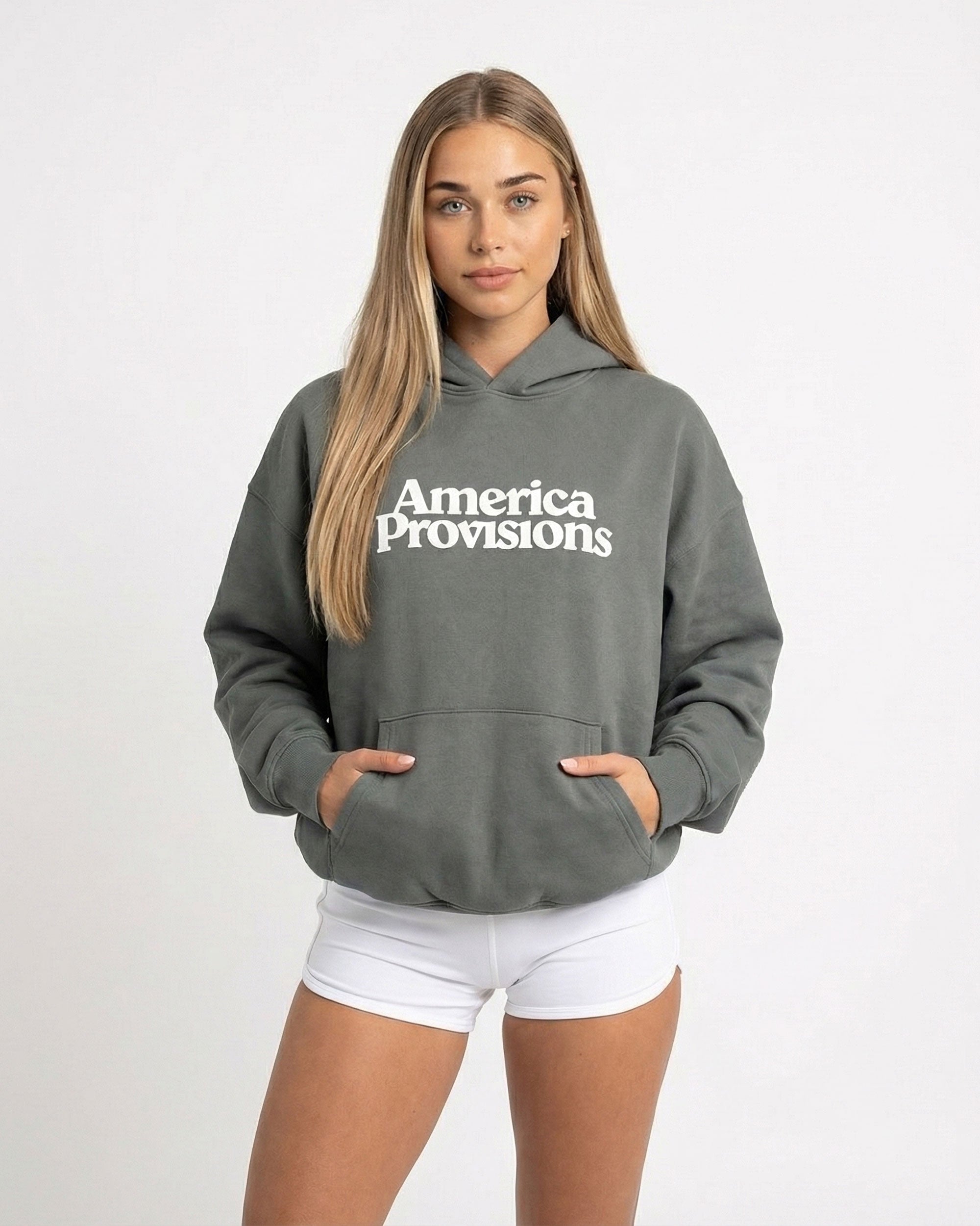 Woman wearing a Gray hoodie with 'America Provisions' text on a white background